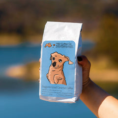 Doggone Good Caramel coffee in a lakeside dachshund scene