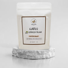 GABEE espresso blend pouch displayed on a stone pedestal