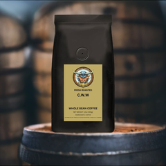 Haluan C.W.W. whiskey barrel-aged coffee bag displayed on a barrel
