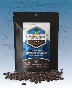Crossed Sabers Cavalry Charge! Dark Espresso Blend bag with scattered beans against a blue map backdrop