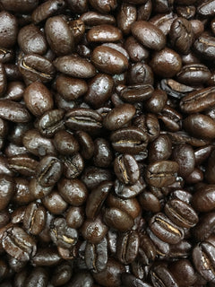 Close-up of roasted beans accompanying Black Powder Italian Blend