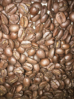 Close-up of roasted beans accompanying Black Powder Bourbon Infused coffee