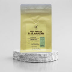 Jamaica Blue Mountain coffee pouch displayed on a stone pedestal
