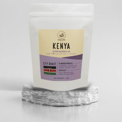 Kenya Njuriga AA coffee pouch on a stone pedestal