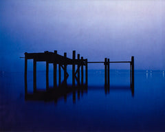 Wooden pier extending over calm water at blue hour — Clear Lake Gourmet Donut Shop Coffee gallery