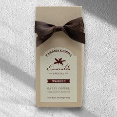 Ribbon-tied Panama Geisha washed coffee bag in sunlight