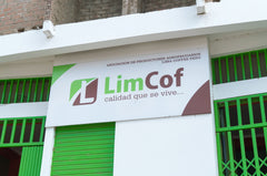 LimCof sign on a white-and-green building — Tiny Footprint Peru Lima Cafe Medium Roast Coffee