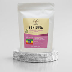 Ethiopia Yirgacheffe Konga coffee pouch on a stone pedestal