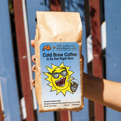 Cold Brew Is So Hot Right Now coffee by a summer fence