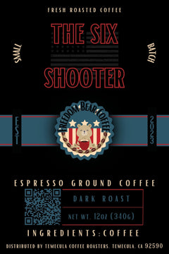 Flat The Six Shooter Dark Roast Coffee label with red Six Shooter lettering and Freedom Bear crest