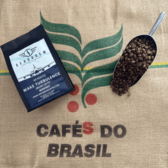 Wake Turbulence coffee and bean scoop on a Brazil-marked burlap sack