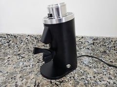 Rear and side view of the black Turin DF54 grinder