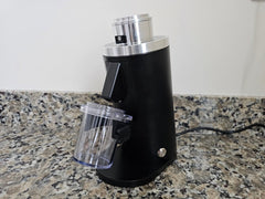 Black Turin DF54 grinder angled view with transparent dosing cup