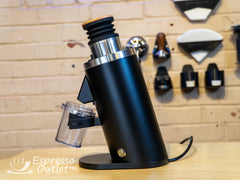 Black Turin DF54 grinder side profile on a coffee bar