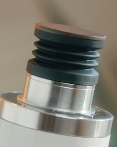 White DF64 Gen 2.7 bellows hopper and wooden lid close-up